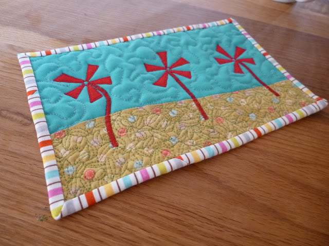 Experimenting with applique and free motion quilting on small projects like mug rugs