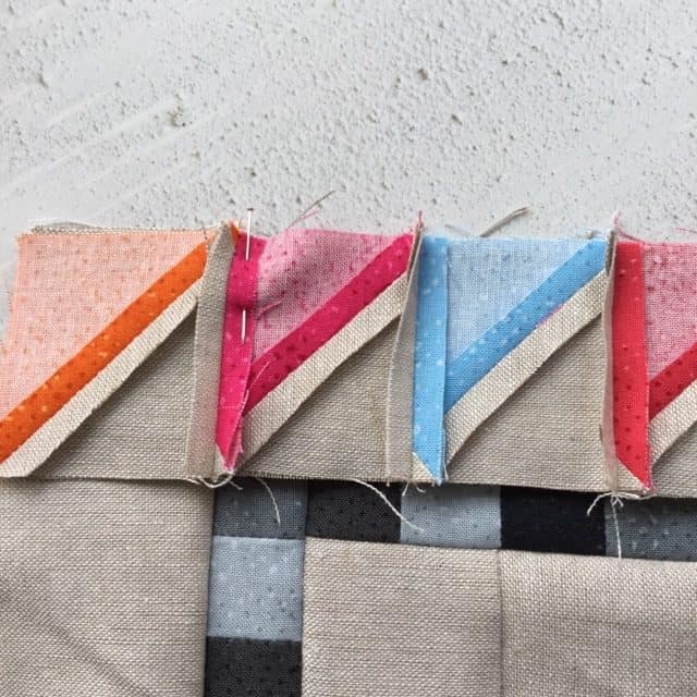 Mini Charm Medallion Cushion Part 2, attaching HSTs for perfect points