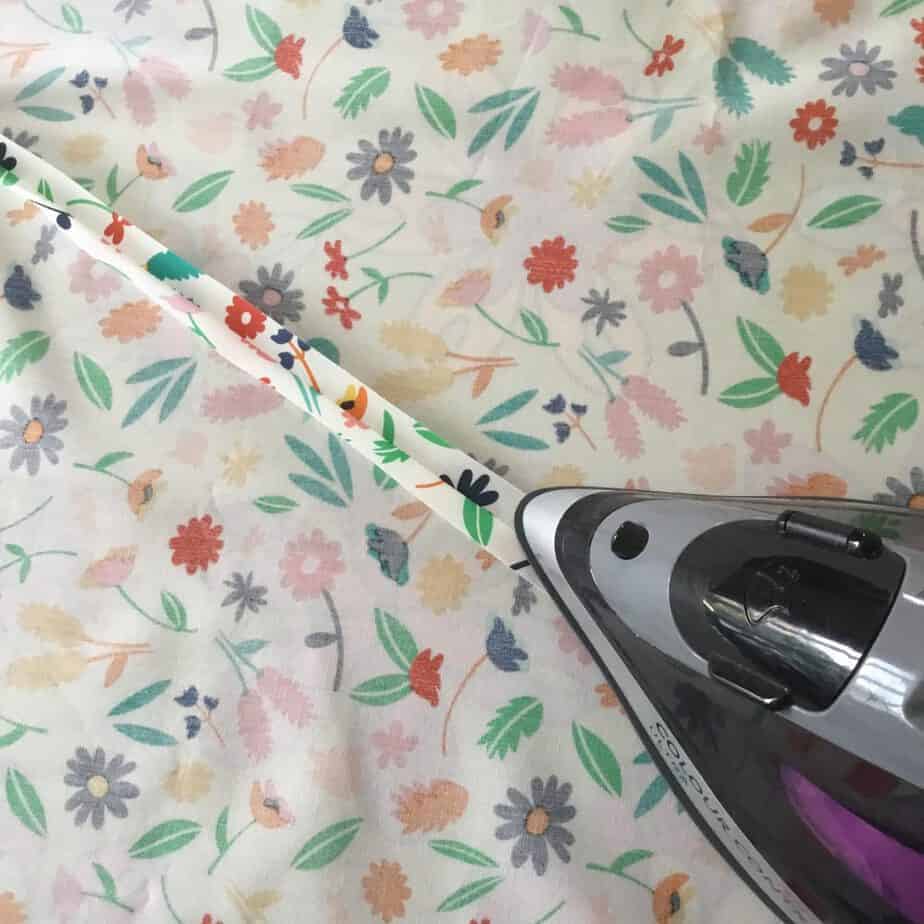 Picture Tutorial for piecing a quilt back diagonally, a great way of stretching fabric further!